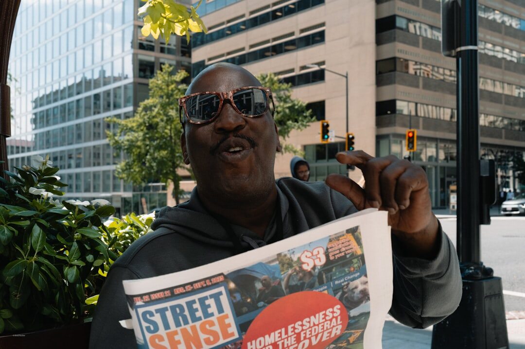 Middle-aged male journalist with glasses reviewing documents